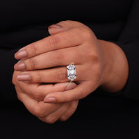 Hand wearing a diamond ring on a black background, Round & Blue Sapphire Fancy CZ Ring, Milgrain Vintage Inspired Engagement Ring