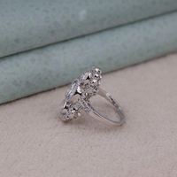 Silver ring with gemstones on a neutral background, Vintage Inspired Three Stone Moissanite Ring, Art Deco Milgrain Engagement Ring, Classic Three Stone Bridal Wedding Ring