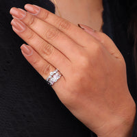 Hand wearing a diamond ring with a blurred black background, Blush Pink & White CZ Stackable Band Set, Dainty Layering Rings for Women