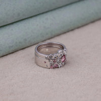 Silver ring with pink gemstones on a beige surface, Romantic Blush Pink Promise Rings For Her, Timeless White CZ Stackable Band Jewelry