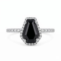 Ring with a black gemstone and diamond accents on a white background