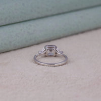 Silver ring with a diamond on a light background, Asscher & Triangle Cut Moissanite Ring – Classic Three Stone Engagement Jewelry