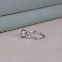 Silver ring with a diamond on a light background, Asscher Center Triangle Side Moissanite Ring – Three Stone 14K Gold Wedding Ring