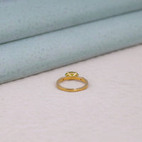 Gold ring with a diamond on a light gray surface, modern engagement ring, vintage inspired ring, romantic CZ ring, minimalist marquise ring, ethical engagement ring, green gemstone ring, east west peridot ring, elegant CZ ring for her, gemstone promise ring