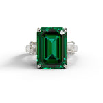 Green emerald ring with diamond accents on a white background, Green & White Emerald Cut CZ Gemstone Trilogy Ring