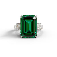 Green emerald ring with diamond accents on a white background, Green & White Emerald Cut CZ Gemstone Trilogy Ring