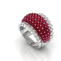 Ring with red gemstone and white accents on a white background