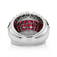 Silver ring with red gemstones on a white background