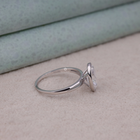 Silver ring with a diamond on a textured surface, Classic Bezel Oval Cut Wedding Jewelry, 14K Gold Oval Bezel Engagement Ring For Bride, Minimalist Oval Solitaire Proposal Ring