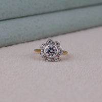 Diamond ring with floral design on a light gray background