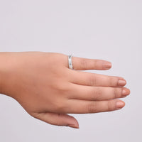 Hand wearing a silver ring on a light gray background, 14K Gold Stackable Ring, Moissanite Promise Ring