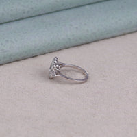 Silver ring with a diamond on a textured surface, Garden Theme Promise Ring, Eco-Friendly Moissanite Jewelry, Floral Inspired Proposal Ring, Handmade Moissanite Ring