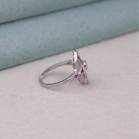 Silver ring with a pink gemstone on a light gray surface,  heirloom style ring, antique inspired CZ ring, pink CZ promise ring, romantic pink CZ ring, fancy CZ stone ring, CZ engagement ring alternative, CZ gemstone ring, pink CZ bridal ring, oval navette ring, handcrafted CZ ring