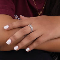 Close-up of a hand wearing a silver ring with a diamond, against a blurred background, Round Moissanite Wedding Band, Nature Inspired Engagement Band, Antique Style Moissanite Ring, Ethical Moissanite Jewelry, Moissanite Anniversary Band