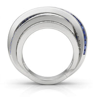 Silver ring with blue gemstones on a white background