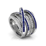 Elegant ring with blue gemstones and diamonds on a white background