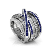 Elegant ring with blue gemstones and diamonds on a white background