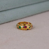 Gold ring with colored gemstones on a neutral background, Star Shape Celestial Ring – Colorful Round CZ Gemstone Flush Setting Band
