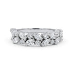 Silver ring with marquise-shaped diamonds on a white background