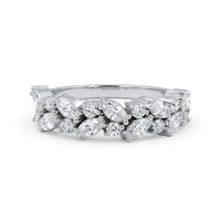 Silver ring with marquise-shaped diamonds on a white background