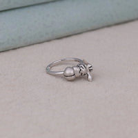 Silver ring with a small bell and cat-shaped charm on a beige surface, Creative Pikachu Sleepy Eevee Gift, Everyday Wear Anime Jewelry For Girls, Cartoon Character Inspired Jewelry Ring