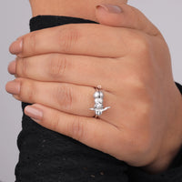 Hand wearing a silver ring with a unique design on a plain background, Pokémon Inspired Couple Promise Ring, Creative Pikachu Sleepy Eevee Gift, Everyday Wear Anime Jewelry For Girls