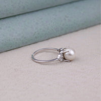 Silver ring with a pearl and diamond on a light background, Pearl Moissanite Ring, Round Moissanite Ring, Elegant Moissanite Ring