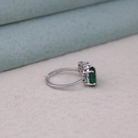 Silver ring with a green gemstone on a light gray surface, Unique Statement Ring for Her, Five Stone CZ Ring