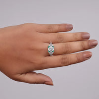 Ring with emerald and diamond on a hand against a gray background, Edwardian era jewelry, hand engraved wedding ring, art nouveau filigree ring, Gatsby era ring, handcrafted antique ring, vintage promise ring