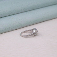 Silver ring with a diamond on a light background, detailed filigree engagement ring, 1920s era fashion ring, timeless heirloom jewelry, deco inspired ring, delicate vintage ring, floral engraving ring