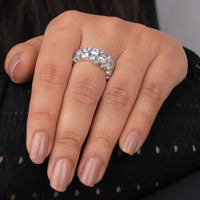 Silver ring with diamonds on a hand against a black background, Elegant Round Moissanite Anniversary Ring, 14K Gold Bubble Wedding Ring For Brides, Conflict Free Moissanite Eternity Jewelry