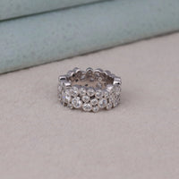 Silver ring with multiple rows of diamonds on a light gray surface, Chic Bubble Eternity Anniversary Ring For Women, Everyday Wear Stackable Moissanite Fashion Ring, Dainty Round Moissanite Bridal Stack Ring