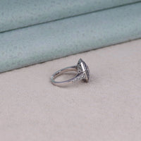 Silver ring with gemstones on a soft fabric background, octagon cut gemstone ring, fancy CZ gemstone ring, halo engagement ring, CZ halo vintage ring, blue stone statement ring, sapphire statement ring