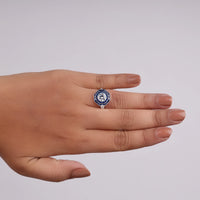 Hand wearing a ring with a blue gemstone on a plain background, Antique Style Ring, Blue Sapphire CZ Ring