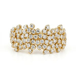 Gold bracelet with clear gemstones on a white background