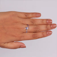 Hand wearing a silver ring with a heart and small ball design on a light gray background, Fantasy Monster Inspired Ring – Round Amethyst & Black Onyx CZ Stone Design