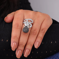 Close-up of a hand wearing two rings on a blurred background, Black & White CZ Octopus Ring, Ocean-Inspired Animal Statement Jewelry
