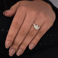 Hand wearing a diamond ring with a dark background, Elegant Vintage Style Bridal Ring, Timeless Moissanite Edwardian Wedding Band, Conflict Free Antique Style Engagement Jewelry