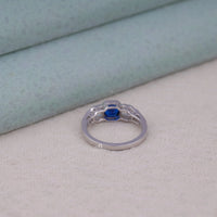 Silver ring with a blue gemstone on a light gray surface, Cushion and Asscher Cut Ring, Blue Stone Vintage Ring