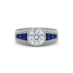 Silver ring with central gemstone and blue gemstones on a white background