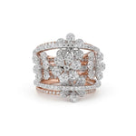 Rose gold and silver floral ring with diamonds on a white background