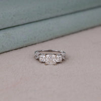 Diamond ring on a neutral background, Princess Cut Vintage Engagement Ring – Moissanite Antique Inspired Wedding Band