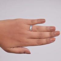 Hand wearing a silver ring on a plain background, East West Oval Moissanite Ring, Knife Edge Engagement Ring, Moissanite Baguette Ring