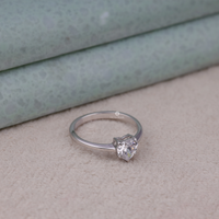 Silver ring with a diamond on a textured surface, Elegant Heart Cut Bridal Engagement Ring, Affordable Heart Shape Moissanite Jewelry, Conflict Free Moissanite Solitaire Wedding Ring