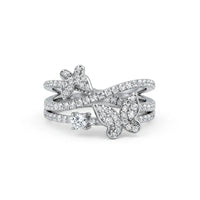Silver ring with diamond accents on a white background