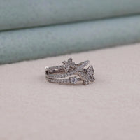Stack of diamond rings on a soft surface with a neutral background