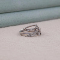Silver ring with gemstones on a soft surface