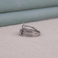 Silver ring with gemstones on a soft surface