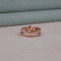 Rose gold ring on a soft fabric background
