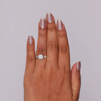 Hand wearing a diamond ring with glittery nail polish on a plain background, Round Moissanite Art Deco Filigree Ring, Vintage Milgrain Solitaire Engagement Jewelry